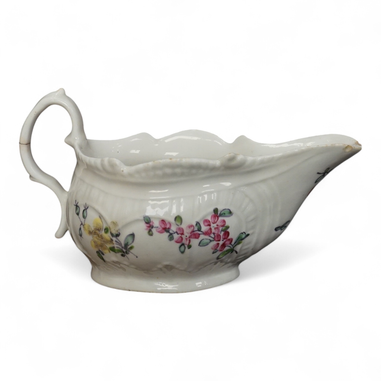 A Liverpool porcelain sauceboat, handpainted with flowers, circa 1760, 14cm wide